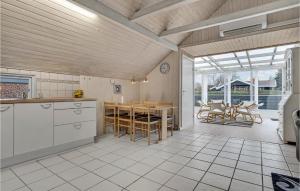 a kitchen and dining room with a table and chairs at Gorgeous Home In Hejls With Wifi in Hejls