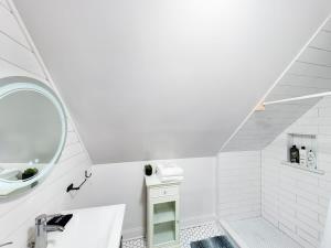 a white bathroom with a sink and a mirror at Chi-Town Ultimate Hideout 1-2-3 in Berwyn +42 photos