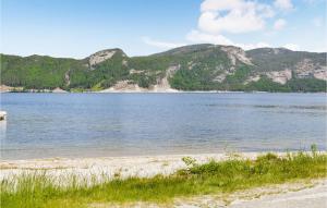 a view of a lake with mountains in the background at Amazing Home In Treungen With Wifi in Treungen +12 photos