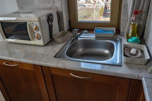 Η κουζίνα ή μικρή κουζίνα στο St. John Hill Apartment, Bansko +24 φωτογραφίες