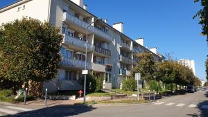 an apartment building on the side of a street at Studio Maurepas centre-ville in Maurepas