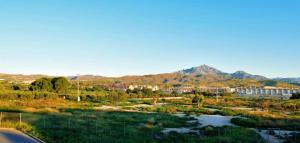a city with a river and mountains in the background at El Campello 1H2C in El Campello