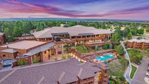 an aerial view of a mansion with a swimming pool at Cheyenne Mountain Resort, a Destination by Hyatt Hotels in Colorado Springs