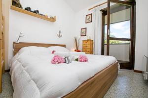 Posteľ alebo postele v izbe v ubytovaní Residence Christina Due Laghi - Happy Rentals