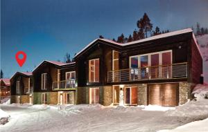 a house in the snow with a red arrow at 5 Bedroom Cozy Home In Hemsedal in Hemsedal