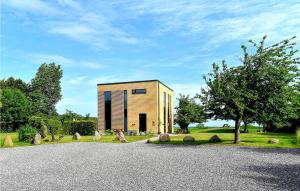 a small house on the side of a road at Villa Hideaway in Tranekær +23 photos