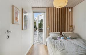 a bedroom with two stuffed animals sitting on a bed at Stunning Home In Gilleleje With Wifi in Gilleleje +10 photos