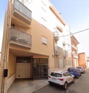 a white car parked in front of a building at Casa el Alfar mudéjar in Teruel