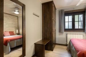A bed or beds in a room at Casa Otal