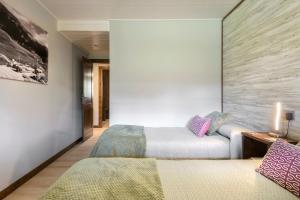 A bed or beds in a room at Casa Otal