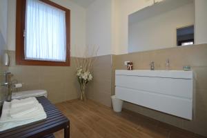 a bathroom with a white sink and a mirror at B&B Ca' Rina in Preganziol +62 photos