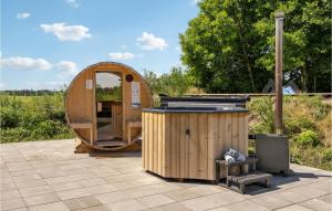 a wooden sauna and a wooden barrelarmaarmaarmaarmaarmaarmaarmaarma at Cozy Home In Tarm With Sauna in Tarm +34 photos