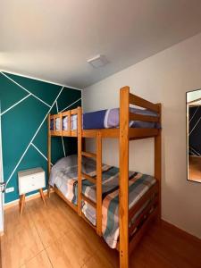 a bedroom with two bunk beds in a room at Departamento COCO - San Bartolo in San Bartolo