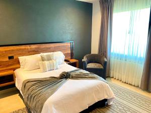Postel nebo postele na pokoji v ubytování HOTEL MINA REAL MATEHUALA