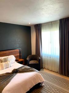 Postel nebo postele na pokoji v ubytování HOTEL MINA REAL MATEHUALA