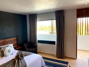 Postel nebo postele na pokoji v ubytování HOTEL MINA REAL MATEHUALA
