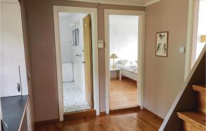 a hallway with a door leading to a bedroom at Five-Bedroom Holiday Home In Mandal in Mandal +8 photos
