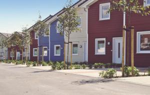 a row of houses are lined up on a street at Gorgeous Home In Dagebüll With Wifi in Dagebüll