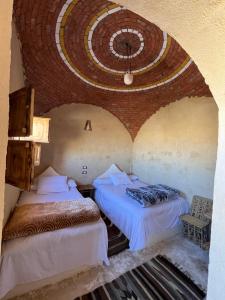 Postel nebo postele na pokoji v ubytování Agpeninshal Ecolodge