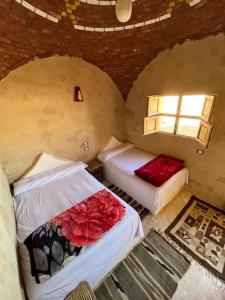 Postel nebo postele na pokoji v ubytování Agpeninshal Ecolodge