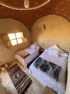 Postel nebo postele na pokoji v ubytování Agpeninshal Ecolodge