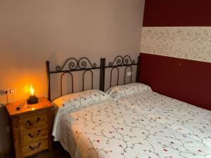 A bed or beds in a room at El Molin de Eloy
