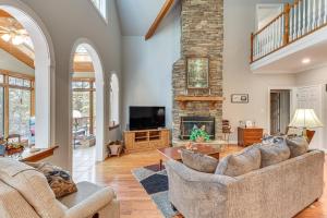 a living room with two couches and a fireplace at Lakefront Hartwell Retreat with Gas Grill and Deck! in Hartwell