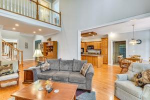 a living room with a couch and a table at Lakefront Hartwell Retreat with Gas Grill and Deck! in Hartwell