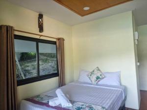 Ένα ή περισσότερα κρεβάτια σε δωμάτιο στο Sea view clif cabin kantiang bay