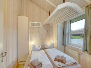Ένα ή περισσότερα κρεβάτια σε δωμάτιο στο 4 star holiday home in Ottendorf +33 φωτογραφίες