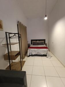a bedroom with a bed and a ladder in it at Casa na histórica - Santana de Parnaíba SP in Santana de Parnaíba