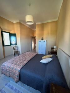 Postel nebo postele na pokoji v ubytování Locanda Val d'Orcia