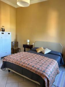 Postel nebo postele na pokoji v ubytování Locanda Val d'Orcia