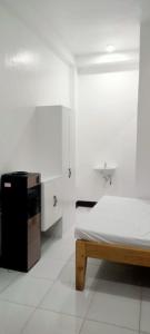 Ένα ή περισσότερα κρεβάτια σε δωμάτιο στο MJ's Guesthouse +3 φωτογραφίες