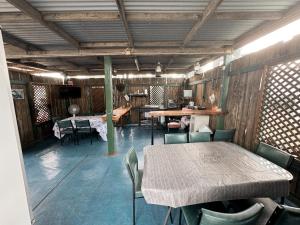 a room with a table and chairs and a table and chairsktop at Injune Motel in Injune