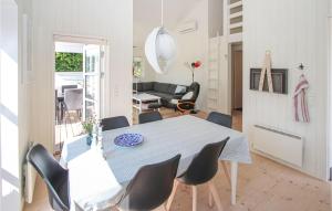 a dining room with a table and chairs at Gorgeous Home In Samsø With Kitchen in Onsbjerg