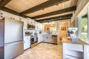 a large kitchen with white appliances and a wooden ceiling at Walk to Liberty Mountain Lake-View Ski Retreat! in Fairfield