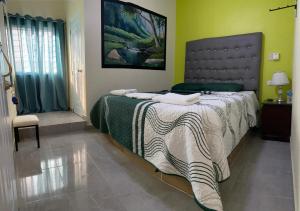 Postel nebo postele na pokoji v ubytování Hotel El Parque Constanza