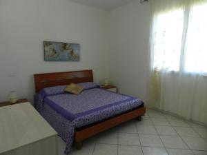 Postel nebo postele na pokoji v ubytování Agriturismo Severini