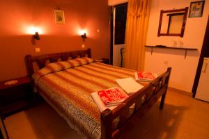 Postel nebo postele na pokoji v ubytování Savas Rooms