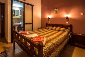 Postel nebo postele na pokoji v ubytování Savas Rooms