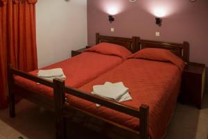 Postel nebo postele na pokoji v ubytování Savas Rooms