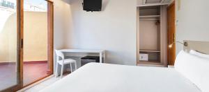 Postel nebo postele na pokoji v ubytování Hotel Andalucía