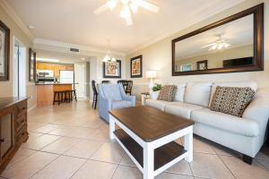 a living room with a couch and a table at Phoenix X 211 condo in Orange Beach