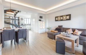 a living room with a couch and a table at Diamond in Binz