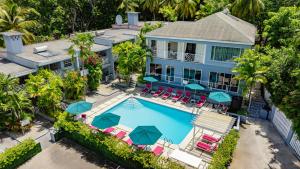 an aerial view of a house with a pool and chairs at The Palms Resort in Saint James