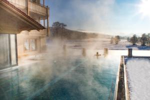 a hot tub with steam coming out of it at Natur-Wohlfühlhotel Brunner Hof in Arnschwang