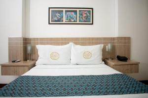 Ένα ή περισσότερα κρεβάτια σε δωμάτιο στο Hotel Cinco Monteria