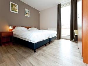 Ένα ή περισσότερα κρεβάτια σε δωμάτιο στο Pet-Friendly Getaway