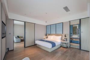 Letto o letti in una camera di Echarm Hotel Nanning East Railway Station